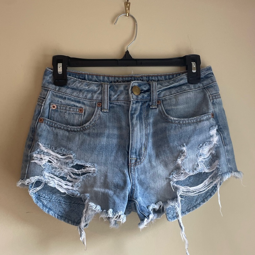 American eagle jean shorts with blue crocheted pockets